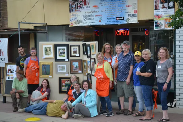 Outdoor photo of Art Domestique in Washington, IA, featuring artists and their paintings